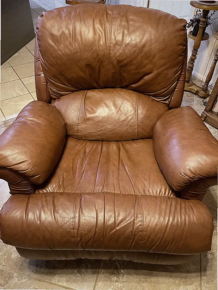 Leather swivel rocker recliner. Excellent condition.